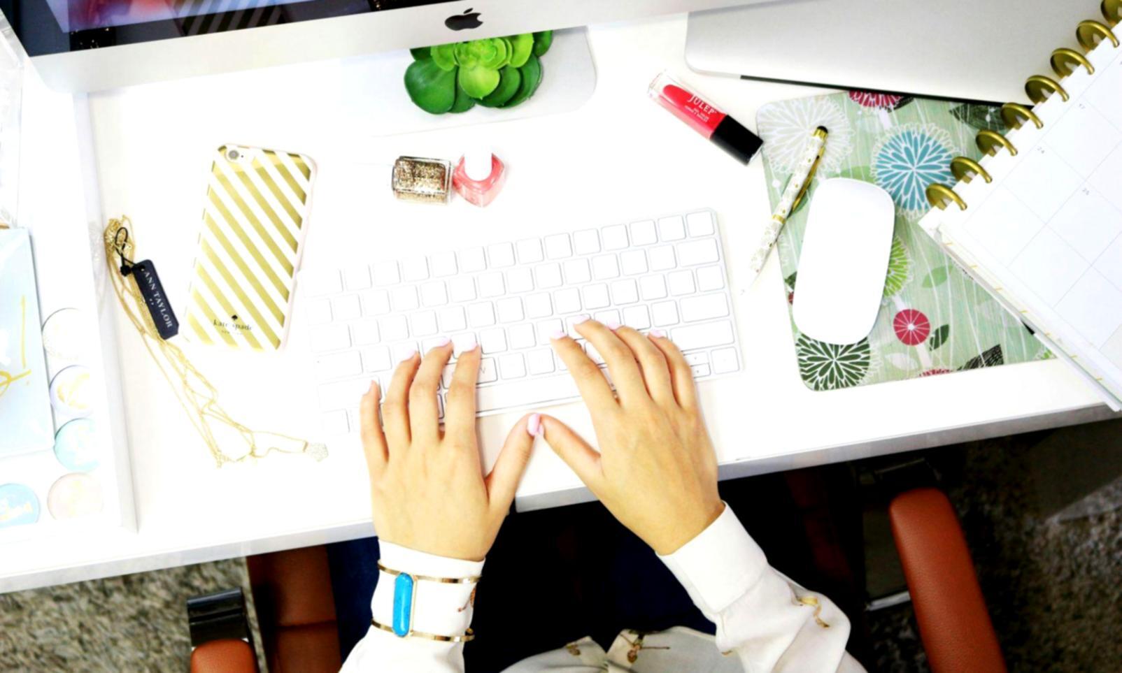 Organized financial workspace with digital tools and planning materials